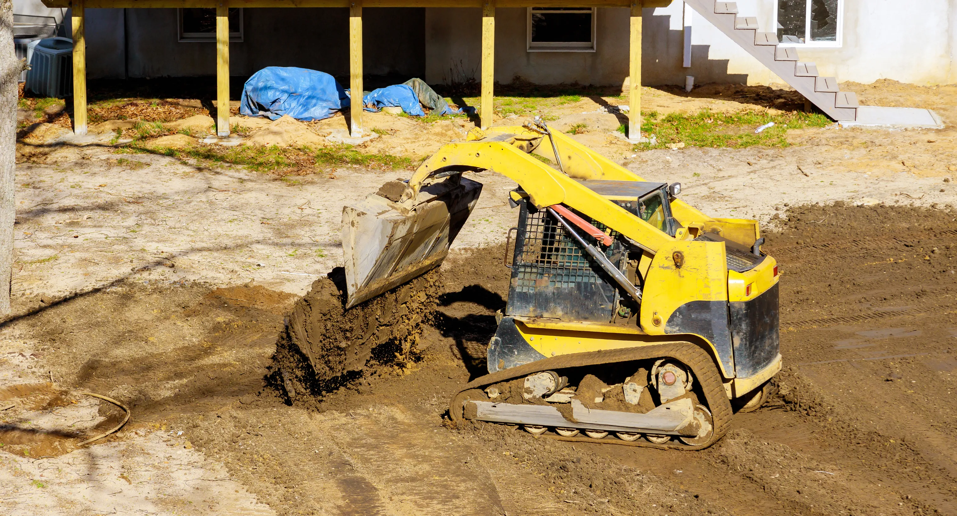 Earth moving service in Dallas TX using heavy machinery to relocate soil and prepare construction sites