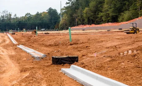 Grading service in Dallas TX leveling land for proper drainage and construction preparation